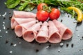 Sliced ham sausage on a stone background Royalty Free Stock Photo