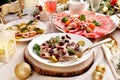 Sliced herrings with cranberry and with pickles Platter with sliced ham and cured meats for Christmas Royalty Free Stock Photo