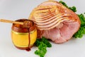 Sliced hickory smoked ham with honey in jar Royalty Free Stock Photo