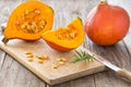 Sliced hokkaido pumpkin on a wooden table