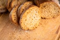 Sliced homemade bread on the wooden cutting board. Selective focus. Shallow depth of field Royalty Free Stock Photo