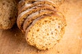 Sliced homemade bread on the wooden cutting board. Selective focus. Shallow depth of field Royalty Free Stock Photo