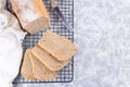 Sliced homemade no knead sandwich bread on cooling rack, horizontal, copy space, top view Royalty Free Stock Photo