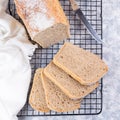 Sliced homemade no knead sandwich bread on cooling rack, top view, square format Royalty Free Stock Photo