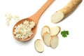 sliced horseradish root with parsley isolated on white background Royalty Free Stock Photo