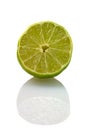 Sliced isolated green lemon (lat. Citrus) Royalty Free Stock Photo