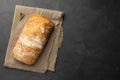 Sliced Italian ciabatta bread on dark background. Royalty Free Stock Photo