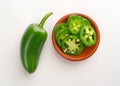Sliced JalapeÃ±o Peppers In Bowl With Pepper To Side