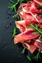 Sliced jamon on a dark background. Selective focus. Royalty Free Stock Photo