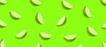 Sliced juicy lime on a bright green background. Fresh fruits. Fruit background. Summer party. Birthday Royalty Free Stock Photo