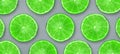 Sliced juicy lime on a gray background. Fresh fruits. Fruit background. Summer party. Birthday Royalty Free Stock Photo