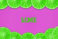 Sliced juicy lime on a purple background. Fresh fruit. Fruit background Royalty Free Stock Photo