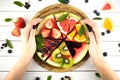 Sliced juicy watermelon pizza on white wooden table. Royalty Free Stock Photo