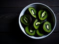 Sliced kiwi fruit in a bowl.