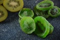 Sliced kiwi fruit in pieces fresh and dried