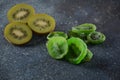 Sliced kiwi fruit in pieces fresh and dried