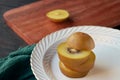 Sliced kiwi fruit on a white plate, close-up of golden kiwi fruit Royalty Free Stock Photo