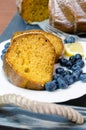 Sliced lemon cake with blueberries on wooden tray Royalty Free Stock Photo