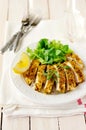 Sliced lemon herb crusted chicken breast, copy space for your text Royalty Free Stock Photo