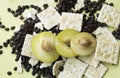 Sliced of Lemon Plum put on Biscuit and blurred coffee beans