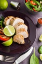 Sliced lime pork tenderloin on dark canvas background close up Royalty Free Stock Photo