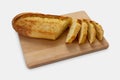 Sliced loaf of durum wheat semolina bread on wooden cutting board Royalty Free Stock Photo