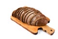 Sliced loaf of rye bread isolated on a white background. Bread slices on wooden cutting board viewed from above. Top view