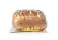 Sliced loaf of wheat bread in plastic bag isolated Royalty Free Stock Photo