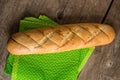 Sliced long french bread over wooden table. Baguette. Restaurant