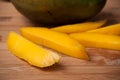 Sliced mango fruit on wooden cutting board in bamboo Royalty Free Stock Photo