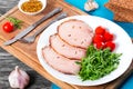 Sliced meat with arugula salad, cherry tomatoes, top view, close