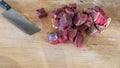 Sliced meat and a knife on a chopping board close-up. Raw meat for cooking. Fresh raw stir fry beef strips Royalty Free Stock Photo