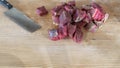 Sliced meat and a knife on a chopping board close-up. Raw meat for cooking. Fresh raw stir fry beef strips. Royalty Free Stock Photo