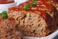 Sliced meat loaf with tomato sauce macro, horizontal Royalty Free Stock Photo