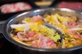 Sliced meat and vegetables boiled in double flavor hot pot Royalty Free Stock Photo