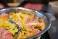 Sliced meat and vegetables boiled in double flavor hot pot Royalty Free Stock Photo