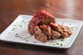 Sliced meatloaf on white plate