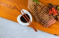 Sliced medium rare grilled beef with soy sauce on cutting board