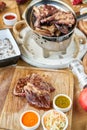 Sliced medium rare grilled Steak Ribeye. Barbecue restaurant menu. Many different food on the table. Dinner party or Royalty Free Stock Photo