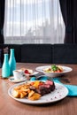 Sliced medium rare grilled Steak Ribeye with french fries Royalty Free Stock Photo