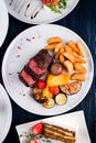 Sliced medium rare grilled Steak Ribeye with french fries Royalty Free Stock Photo