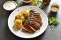 Sliced medium rare roast beef with potato Royalty Free Stock Photo