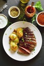 Sliced medium rare roast beef with potato Royalty Free Stock Photo