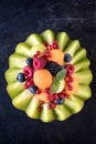 Sliced melon with berry fruit