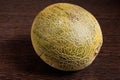 Sliced melon on dark wooden table