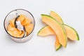 Sliced melon on table. Melon cut into pieces in blender jar Royalty Free Stock Photo