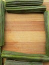 Sliced moringa oleifera frame on wooden background
