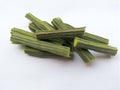 Sliced moringa oleifera heap on white background