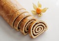 Sliced nut roll pastry with physalis fruit Royalty Free Stock Photo
