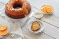 Sliced orange cake served on a white wooden table Royalty Free Stock Photo